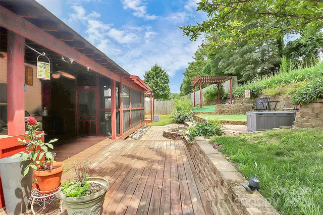 a view of a house with backyard and a porch