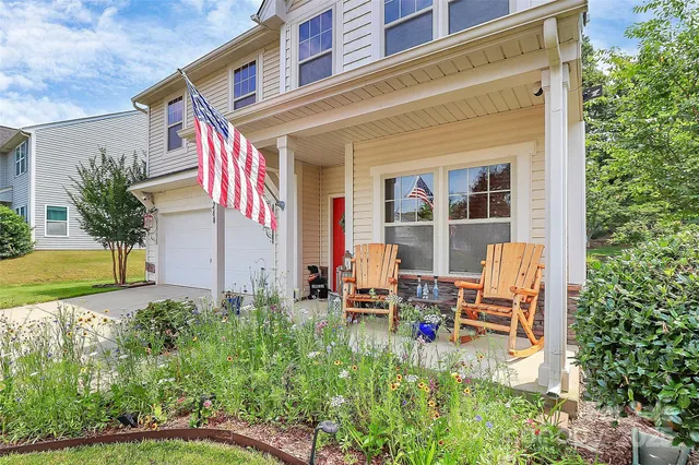a backyard of a house with outdoor seating
