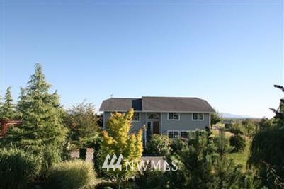 2487 Mountain View Road Ferndale, WA 98248 - Photo 1 of 1 a front view of a house with a yard