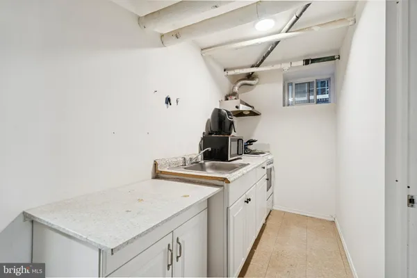 a view of a bathroom with a sink and mirror