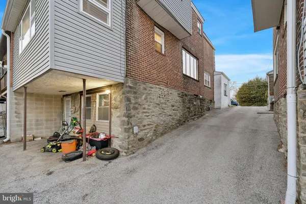 a view of a brick house with many windows