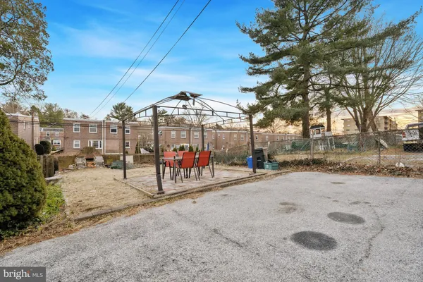 a view of a park with iron fence