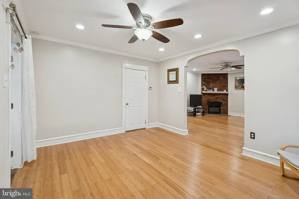 a view of livingroom with hardwood floor and a ceiling fan
