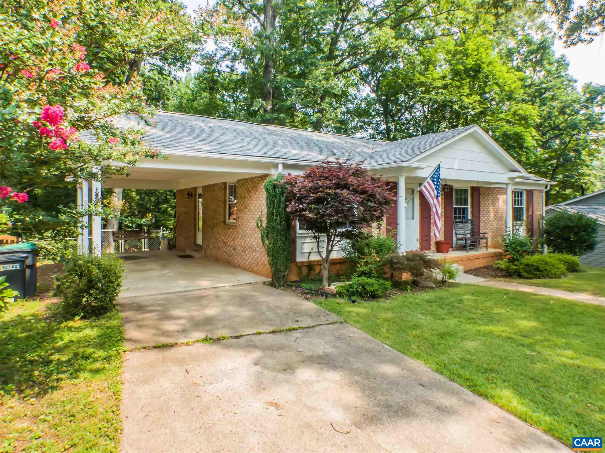 1533 Trailridge Road Charlottesville, VA 22903 - Photo 1 of 35 a front view of a house with a yard and a garage