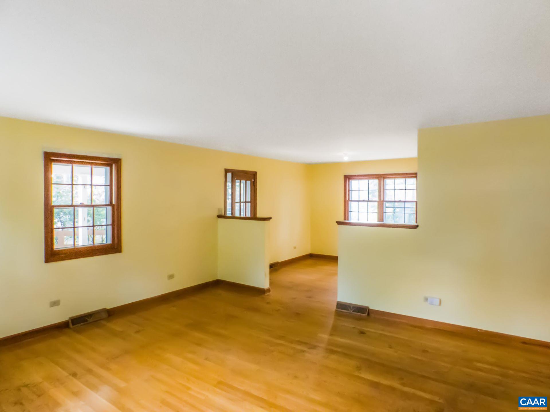 1533 Trailridge Road Charlottesville, VA 22903 - Photo 12 of 35 a view of an empty room with wooden floor and a window
