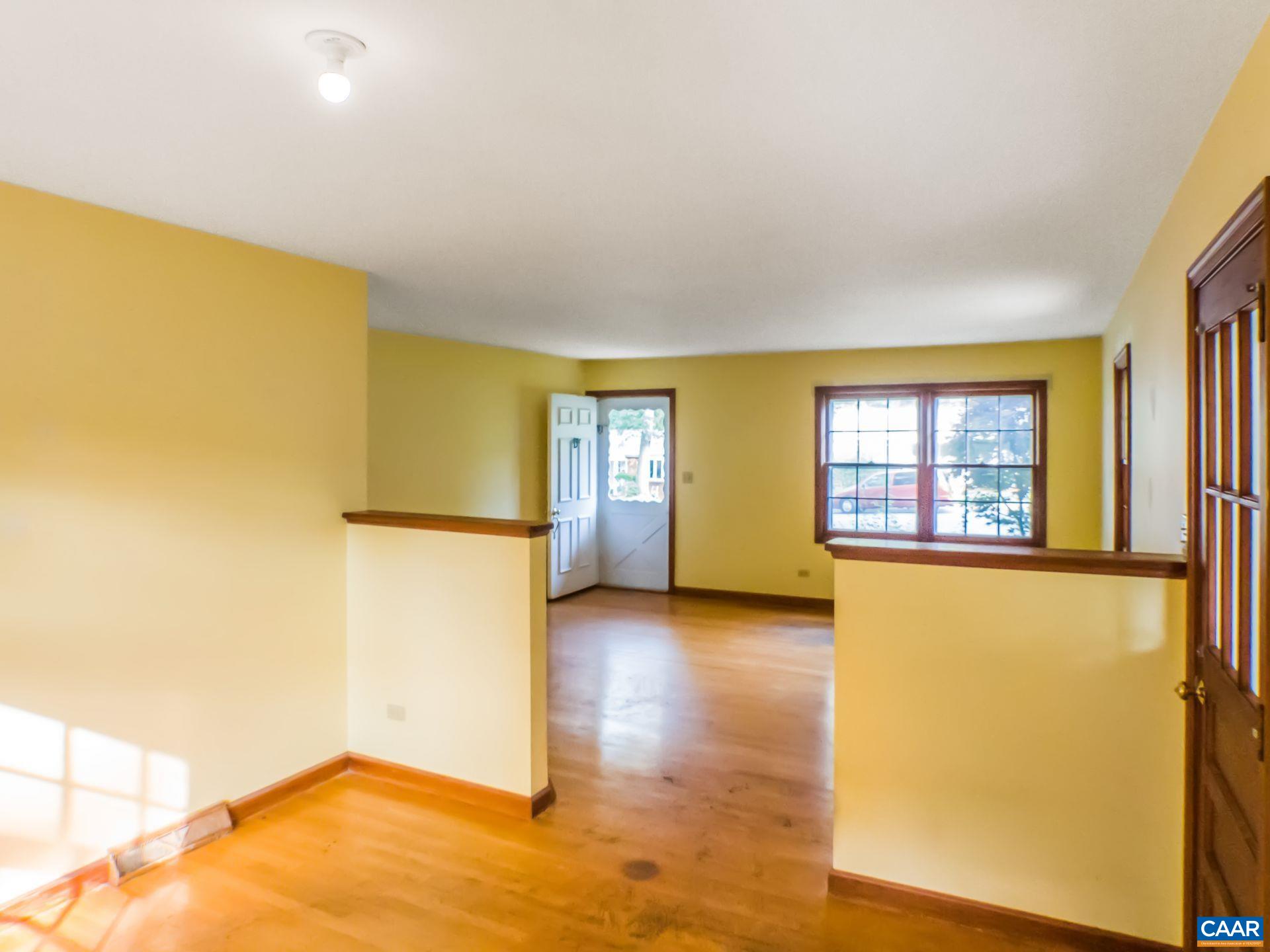 1533 Trailridge Road Charlottesville, VA 22903 - Photo 6 of 35 a view of empty room with wooden floor and fan