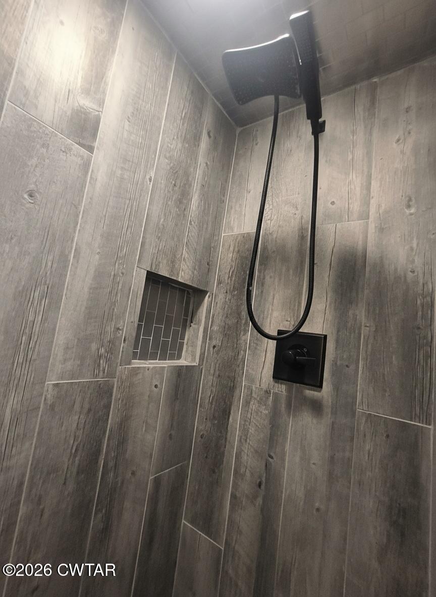 513 Viar Road Dyersburg, TN 38024 - Photo 28 of 37 a bathroom with a mirror and a shower