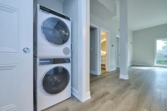 a view of a hallway with washer and dryer