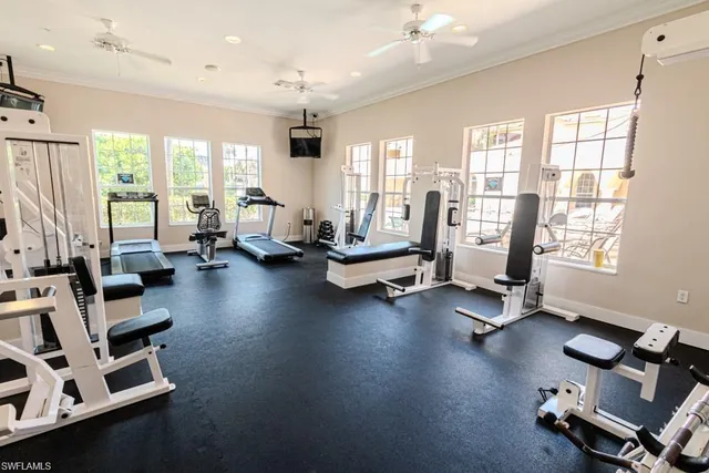 a room with gym equipment and a large window