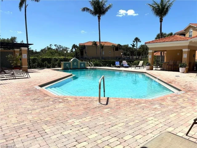 a view of a swimming pool with a patio