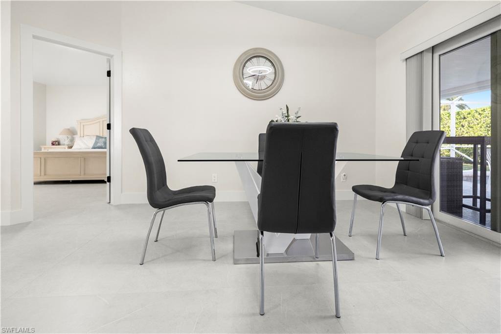 1410 San Marco Road Marco Island, FL 34145 - Photo 12 of 50 a view of a workspace with furniture and a window