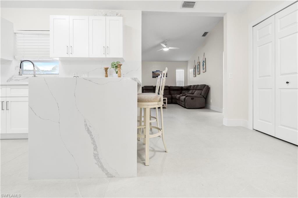 1410 San Marco Road Marco Island, FL 34145 - Photo 17 of 50 a kitchen with a refrigerator and a sink