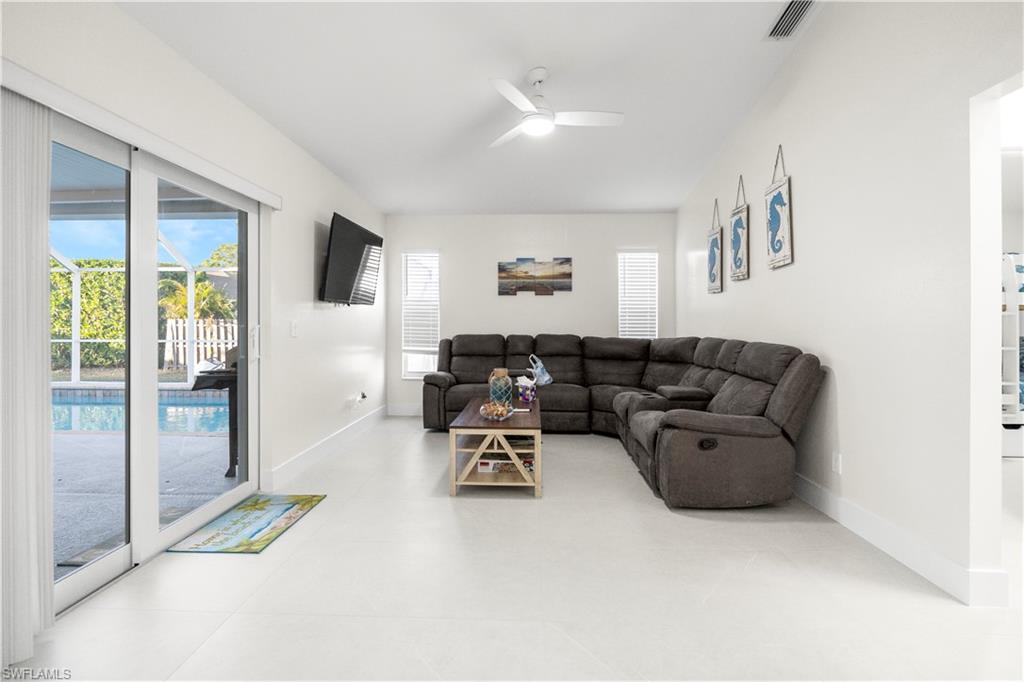 1410 San Marco Road Marco Island, FL 34145 - Photo 21 of 50 a living room with furniture and a table