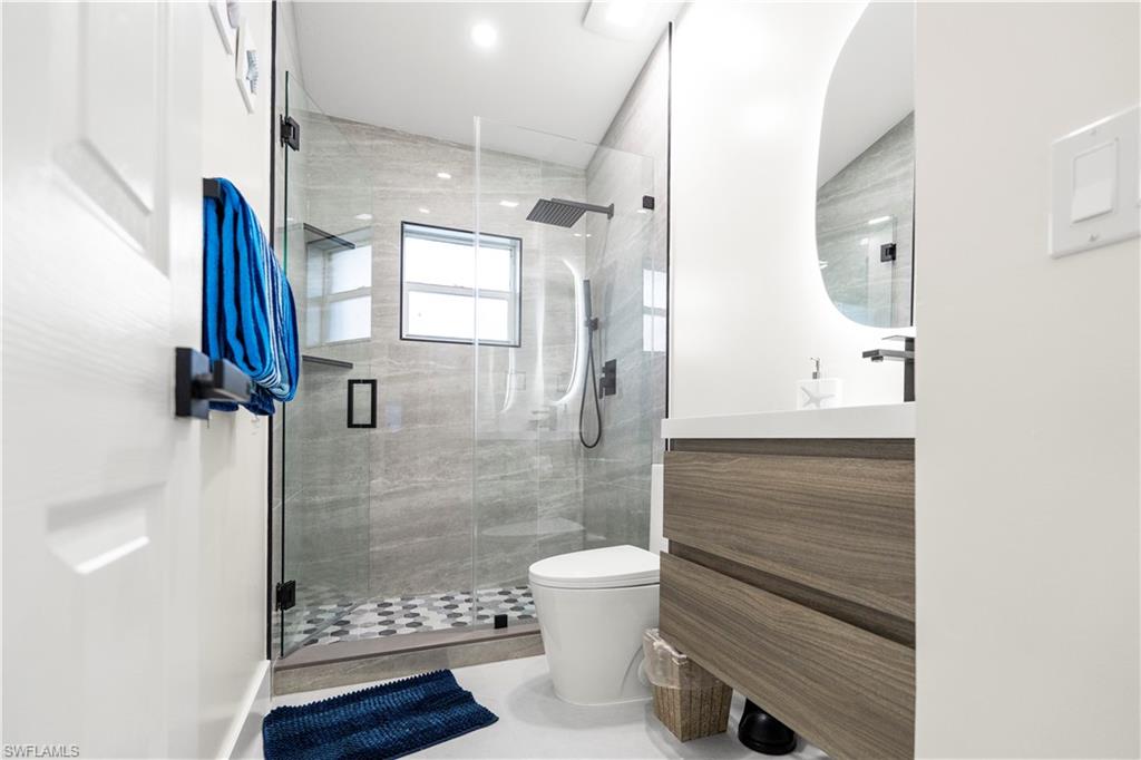 1410 San Marco Road Marco Island, FL 34145 - Photo 25 of 50 a bathroom with a shower and a toilet