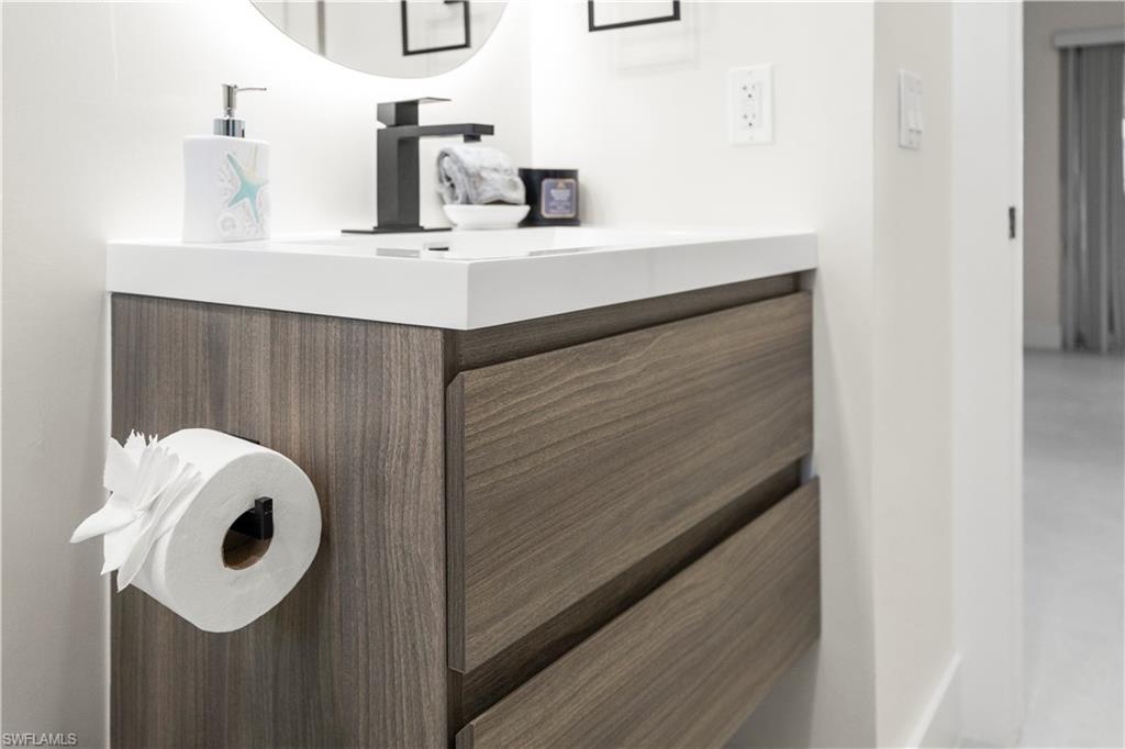 1410 San Marco Road Marco Island, FL 34145 - Photo 27 of 50 a bathroom with a sink and a mirror