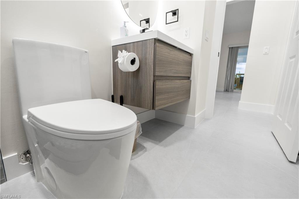 1410 San Marco Road Marco Island, FL 34145 - Photo 28 of 50 a bathroom with a toilet and a shower