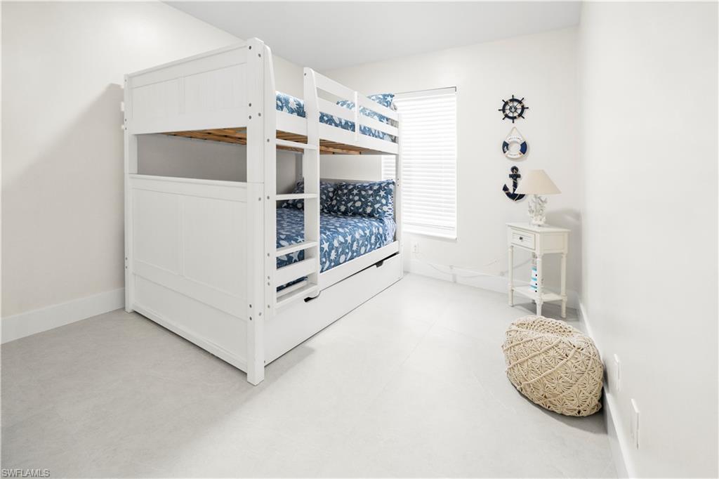 1410 San Marco Road Marco Island, FL 34145 - Photo 30 of 50 a bathroom with a bathtub and a shower