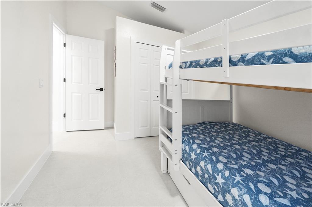 1410 San Marco Road Marco Island, FL 34145 - Photo 31 of 50 a bathroom with a bathtub and a shower