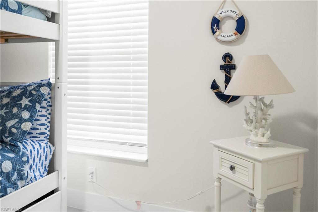 1410 San Marco Road Marco Island, FL 34145 - Photo 32 of 50 a bathroom with a sink and a mirror