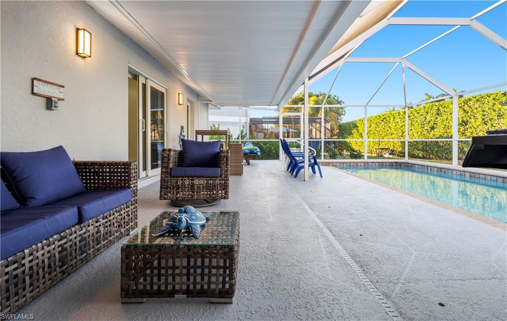 1410 San Marco Road Marco Island, FL 34145 - Photo 35 of 50 a living room with furniture a couch and a table