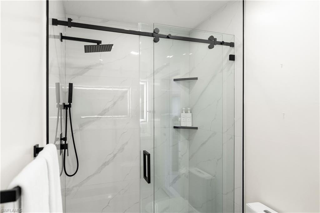 1410 San Marco Road Marco Island, FL 34145 - Photo 40 of 50 a bathroom with a shower