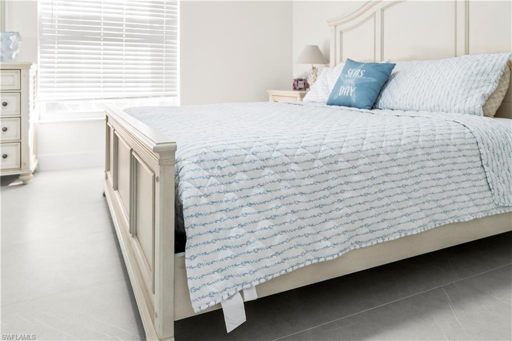 1410 San Marco Road Marco Island, FL 34145 - Photo 45 of 50 a bedroom with a bed and a window