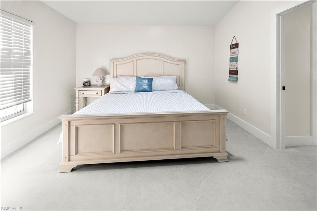 1410 San Marco Road Marco Island, FL 34145 - Photo 47 of 50 a bedroom with a bed and a window