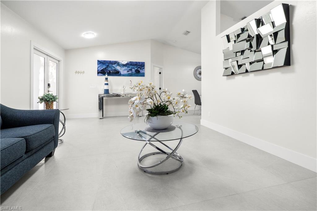 1410 San Marco Road Marco Island, FL 34145 - Photo 9 of 50 a living room with furniture and flowers