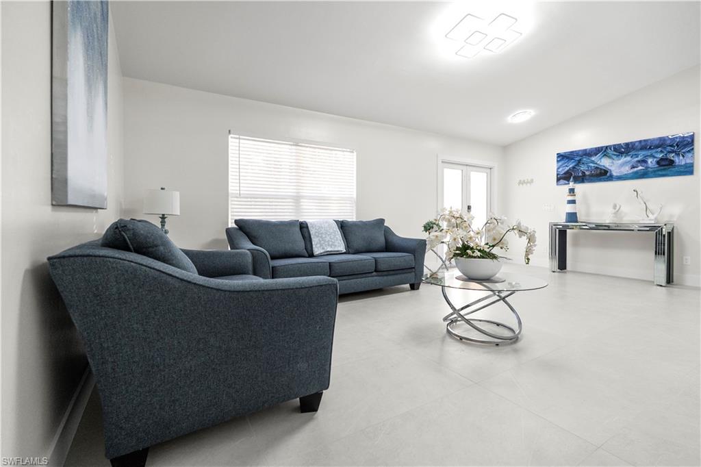 1410 San Marco Road Marco Island, FL 34145 - Photo 10 of 50 a living room with furniture and a couch