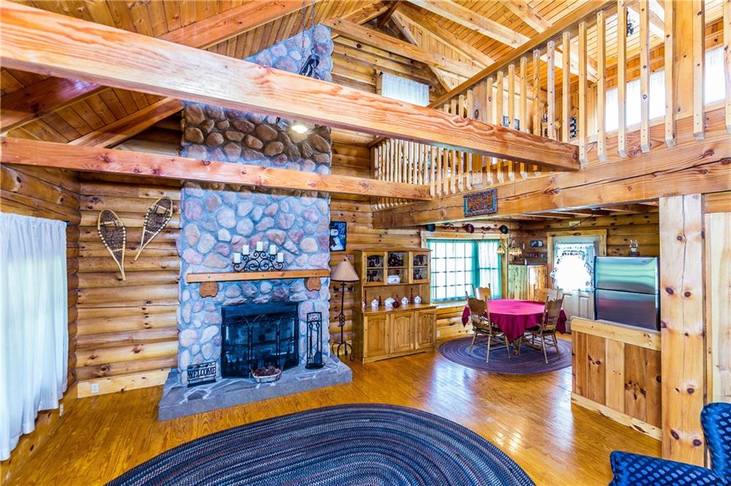 291 Rehoboth Road Belle Vernon, PA 15012 - Photo 2 of 25 2 story open main living area with floor to ceiling cobblestone wood burning fireplace, open to kitchen and dining area