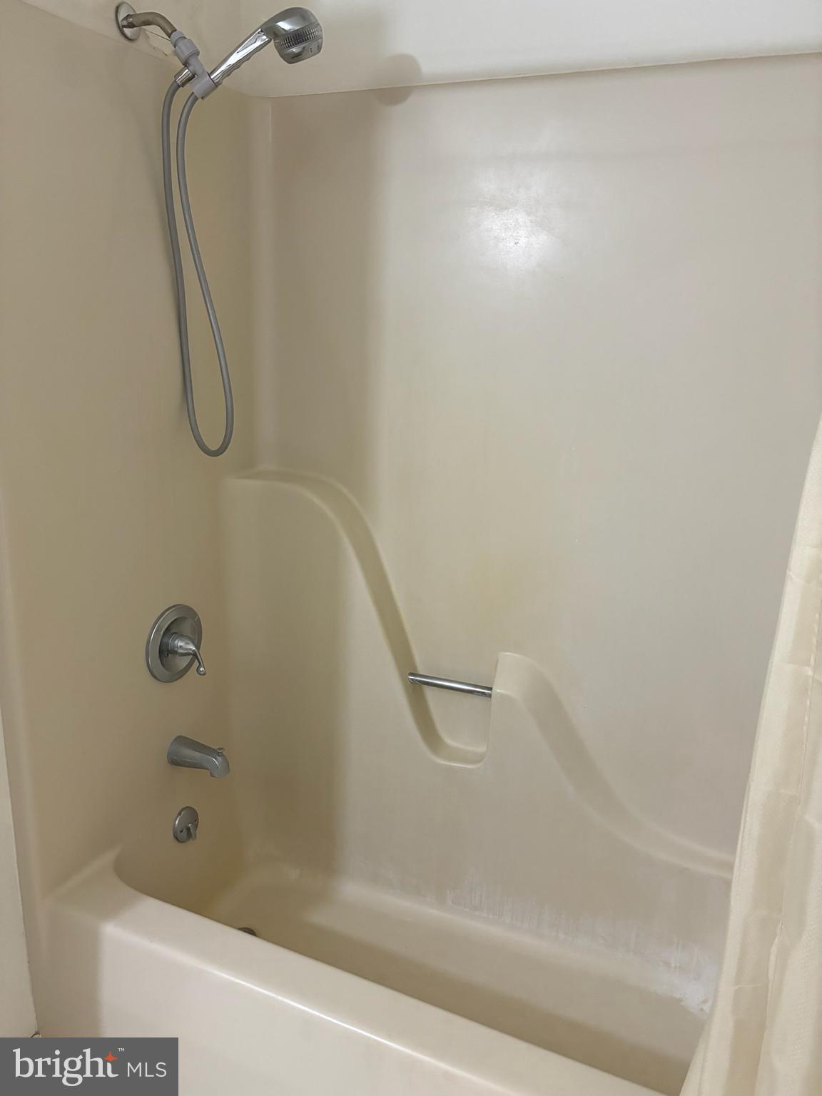 404 Beach Drive Annapolis, MD 21403 - Photo 14 of 25 a bathroom with a bath tub with a shower