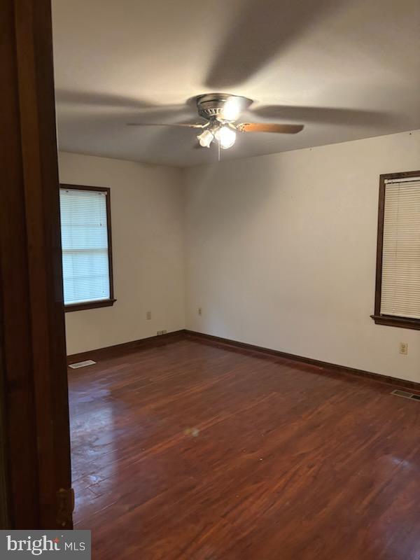 404 Beach Drive Annapolis, MD 21403 - Photo 16 of 25 a view of an empty room with wooden floor and a window