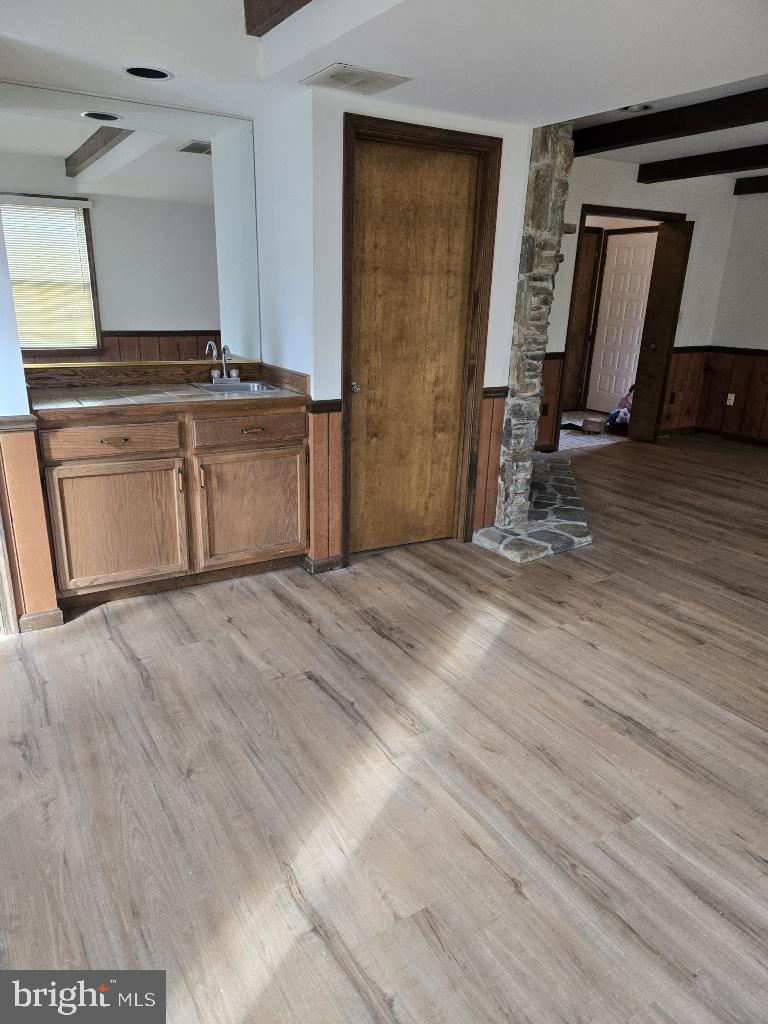 404 Beach Drive Annapolis, MD 21403 - Photo 9 of 25 a view of a kitchen with a sink cabinets and a wooden floor