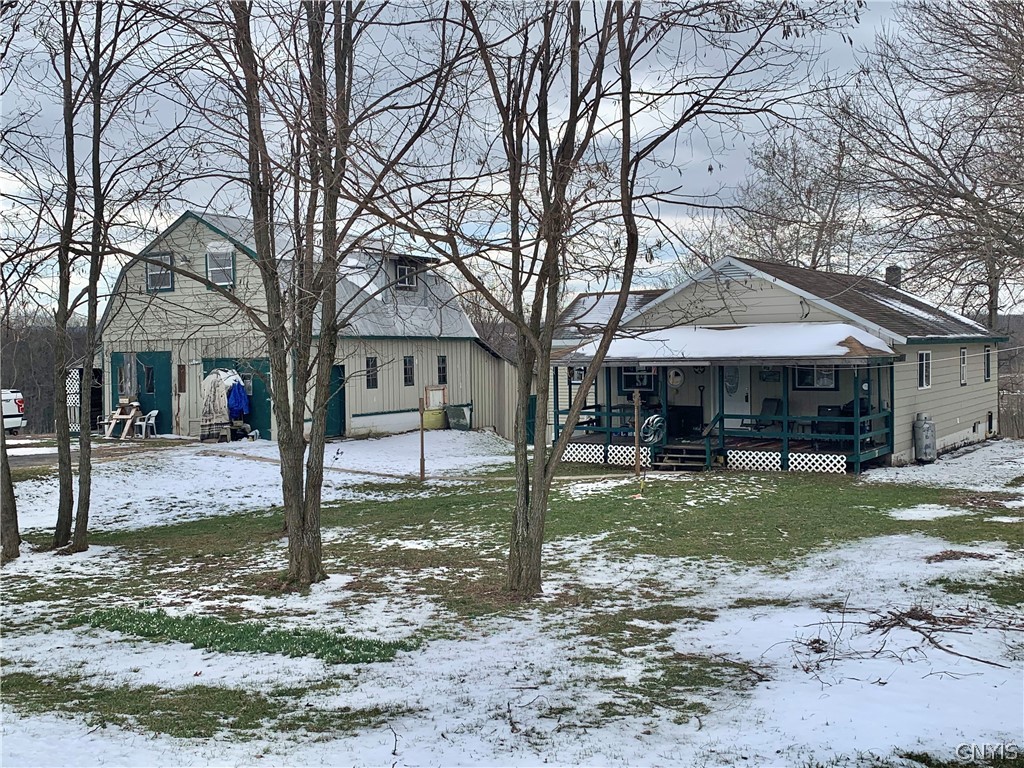Front view of house and barn.