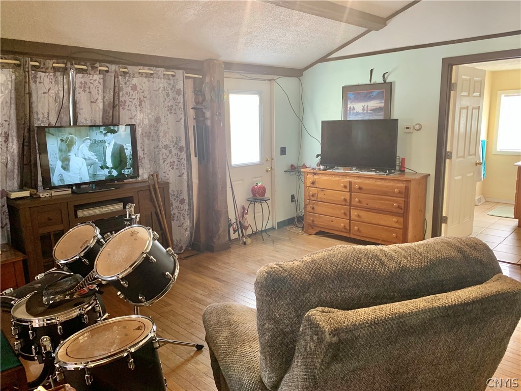 3403 Burke Road Vernon, NY 13477 - Photo 13 of 42 The living room is roomy enough for drum rehearsal