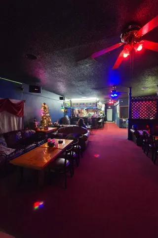 a view of a room with tables and chairs
