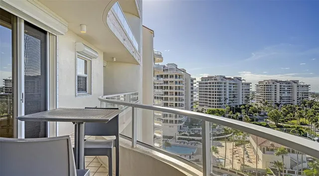 a view of balcony with outdoor seating and city view