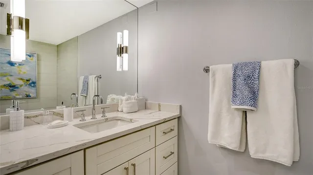 a bedroom with furniture and a large window