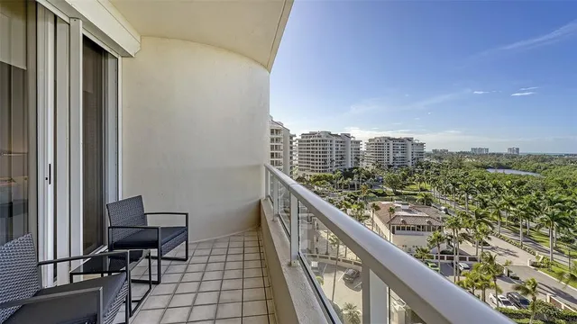 a bathroom with a granite countertop sink toilet mirror and shower