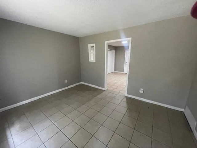 a view of an empty room and window