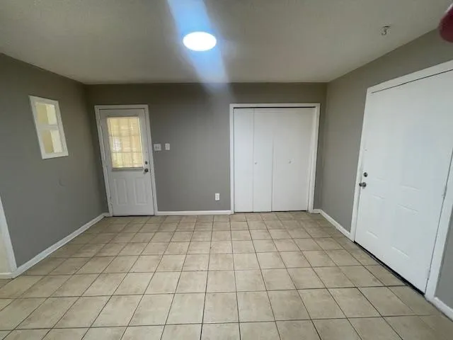 an empty room with windows