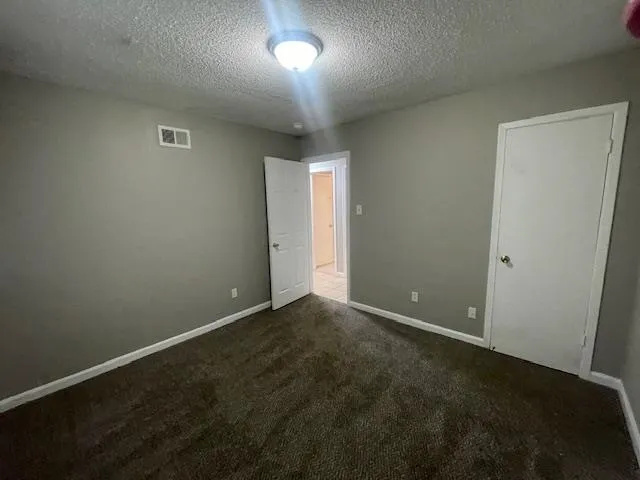 an empty room with a empty space and window