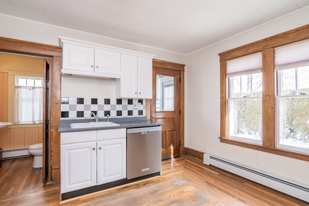 2 Oak Street Easthampton, MA 01027 - Photo 14 of 42 a kitchen with granite countertop a sink cabinets and a window