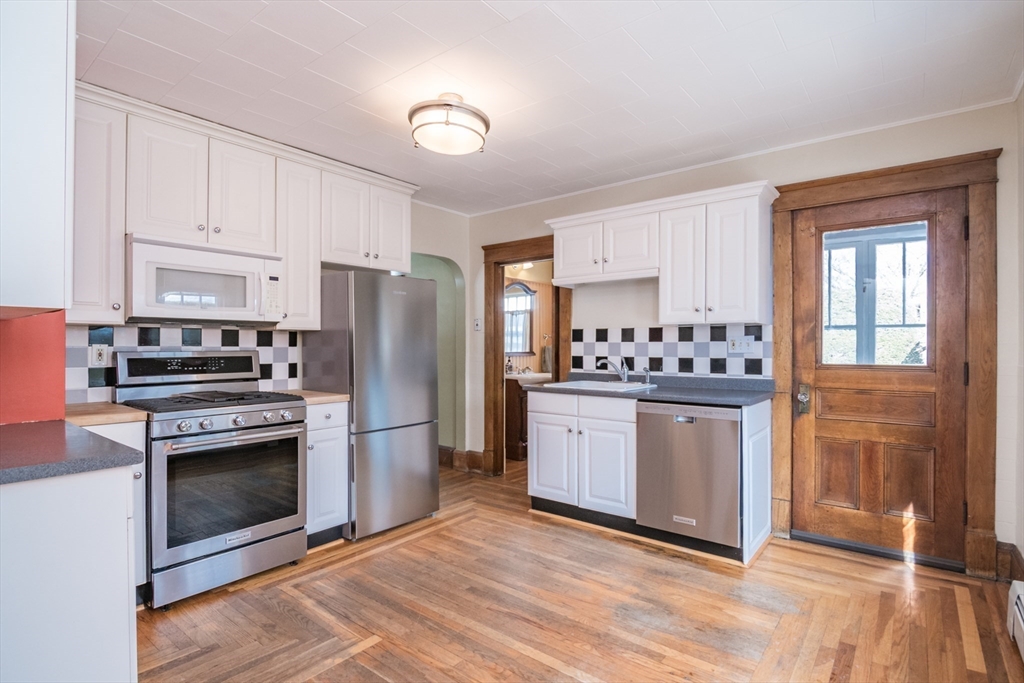 2 Oak Street Easthampton, MA 01027 - Photo 16 of 42 a kitchen with stainless steel appliances granite countertop a refrigerator stove and sink