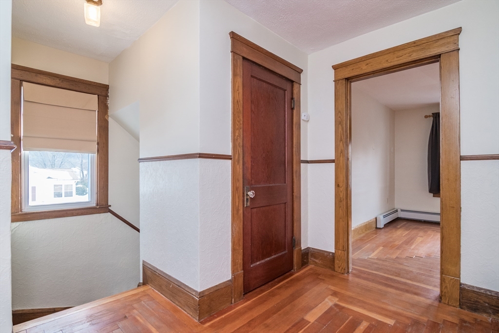 2 Oak Street Easthampton, MA 01027 - Photo 19 of 42 a view of a hallway with closet and wooden floor