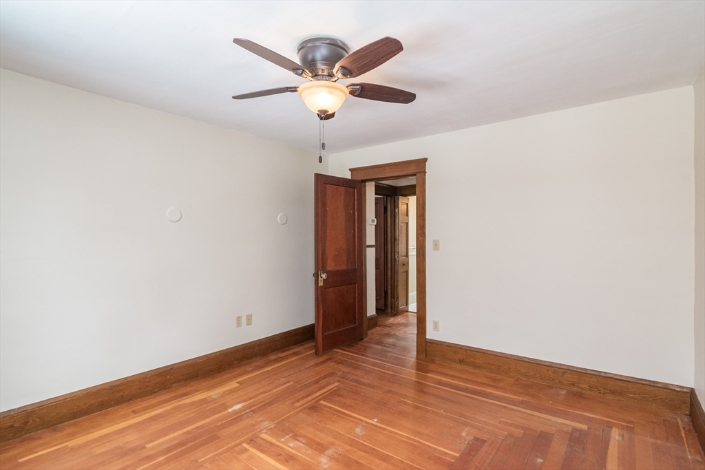 2 Oak Street Easthampton, MA 01027 - Photo 23 of 42 an empty room with closet and a ceiling fan
