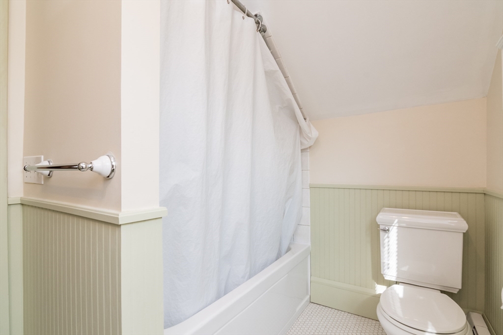 2 Oak Street Easthampton, MA 01027 - Photo 27 of 42 a white toilet sitting next to a shower