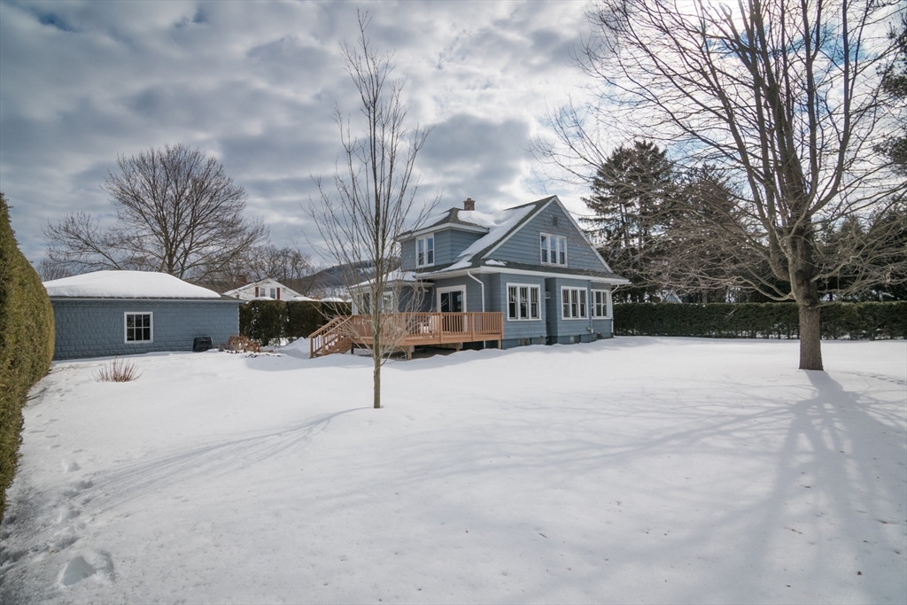 2 Oak Street Easthampton, MA 01027 - Photo 33 of 42 a house with trees in front of it