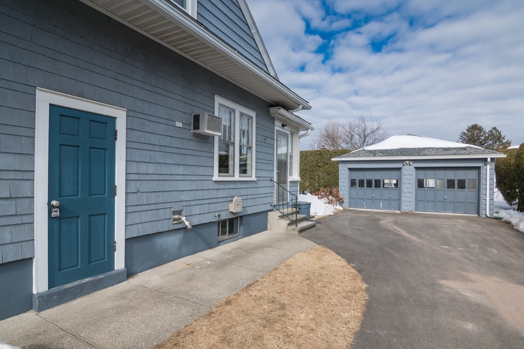 2 Oak Street Easthampton, MA 01027 - Photo 35 of 42 a view of a house with a yard and garage