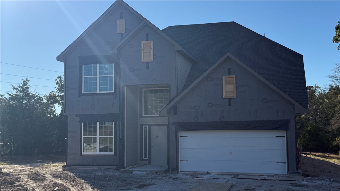 8452 Muir Wood Loop Anderson, TX 77830 - Photo 2 of 10 a front view of a house